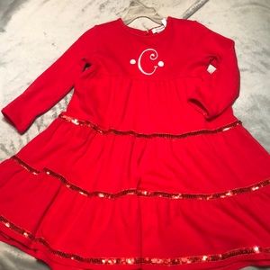 Red sequined, monogrammed dress